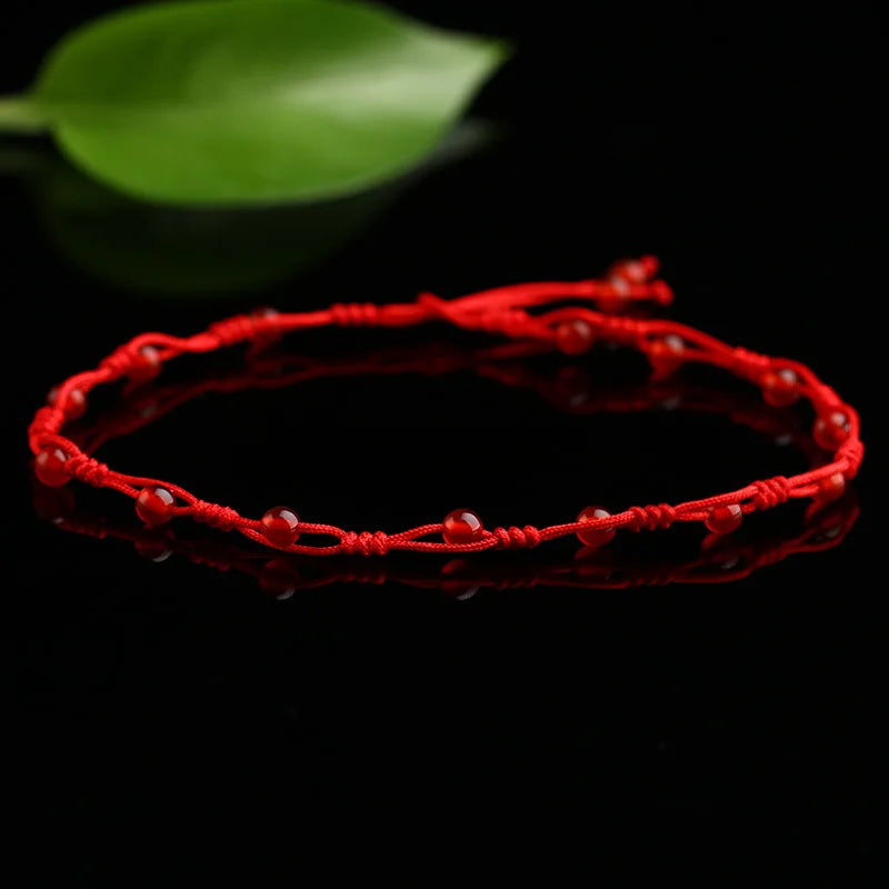 Chaîne de Cheville Tissé Rouge avec Papillon