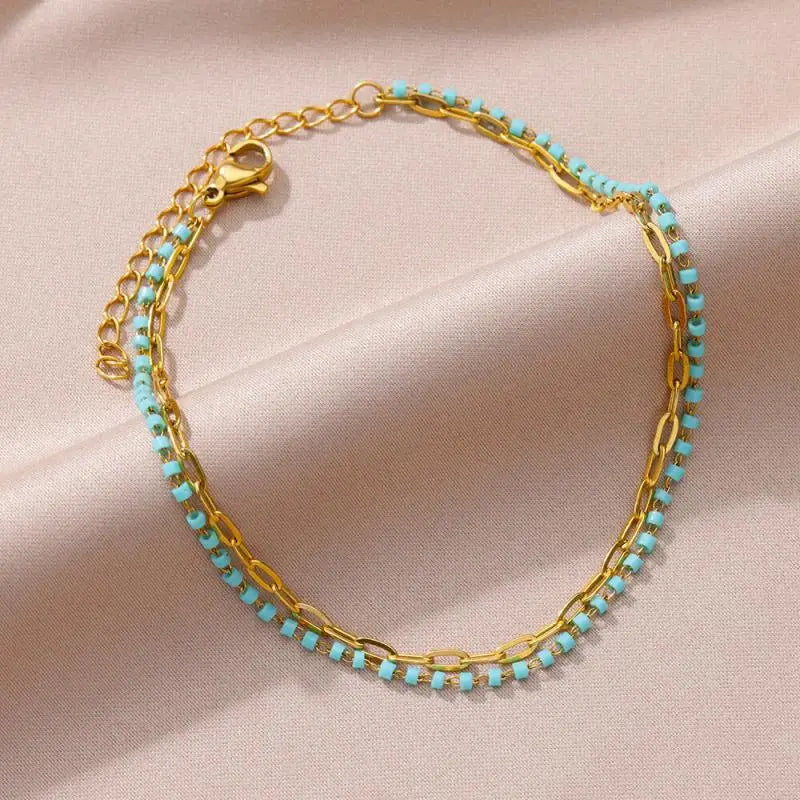 Chaîne de Cheville Dorée avec Croix et Pierres Zirconium