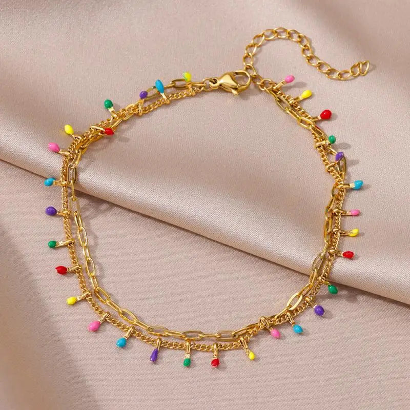 Chaîne de Cheville Dorée avec Croix et Pierres Zirconium