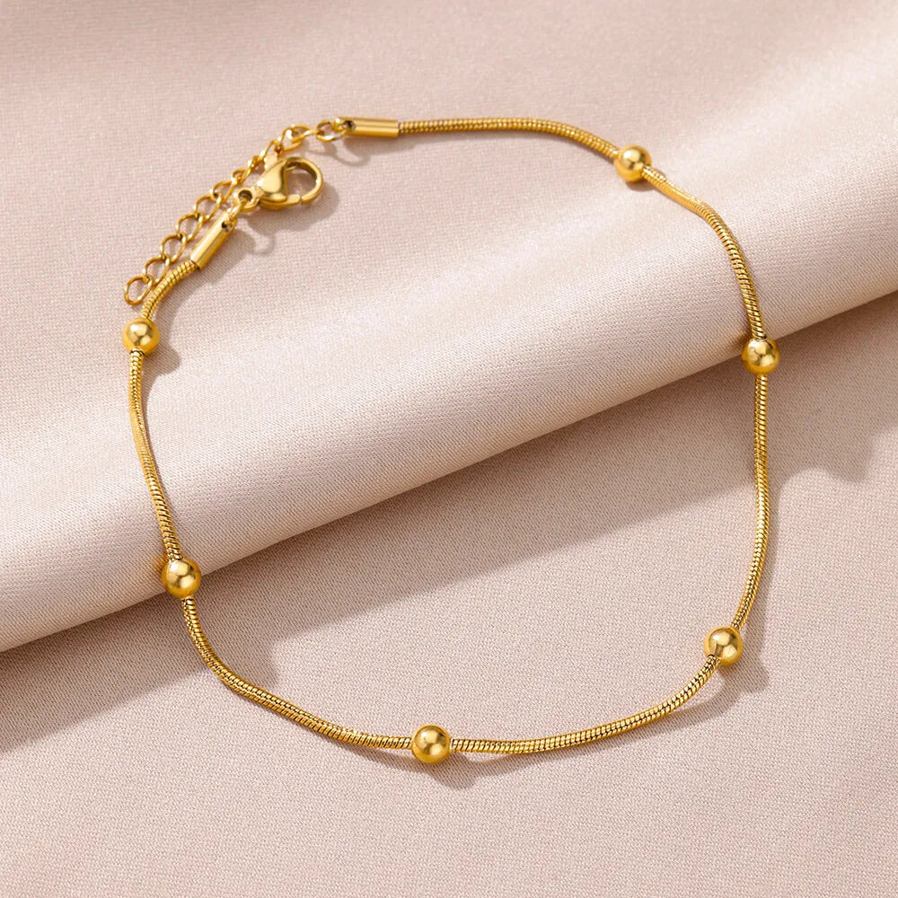 Chaîne de Cheville Dorée avec Croix et Pierres Zirconium