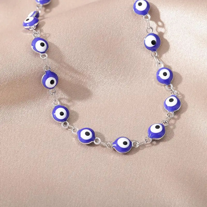Chaîne de Cheville Dorée avec Croix et Pierres Zirconium