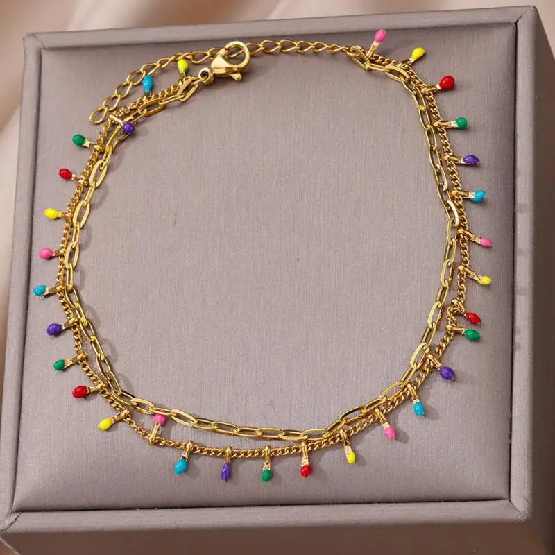Chaîne de Cheville Dorée avec Croix et Pierres Zirconium