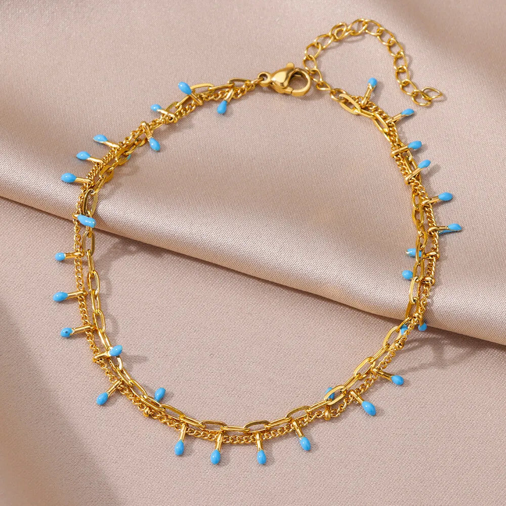 Chaîne de Cheville Dorée avec Croix et Pierres Zirconium