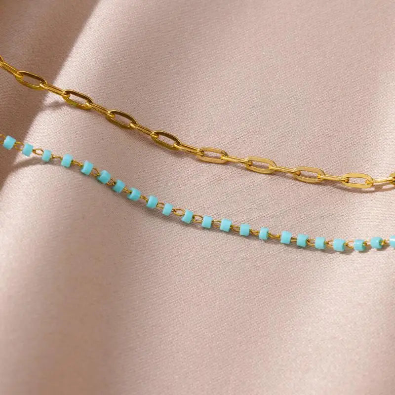 Chaîne de Cheville Dorée avec Croix et Pierres Zirconium