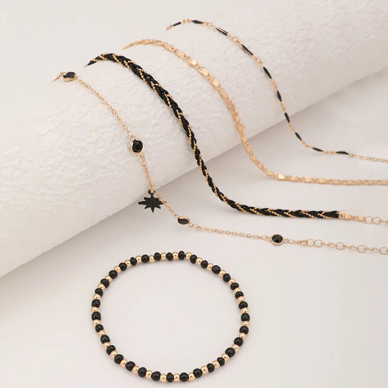Chaîne de Cheville Multi-rangs Dorée et Noire