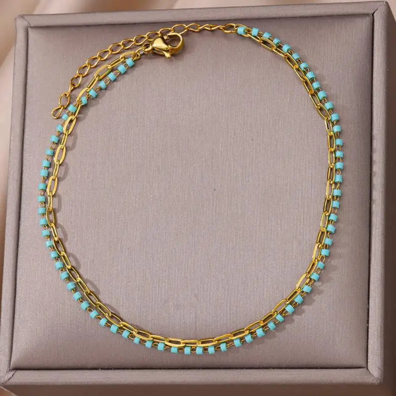Chaîne de Cheville Dorée avec Croix et Pierres Zirconium
