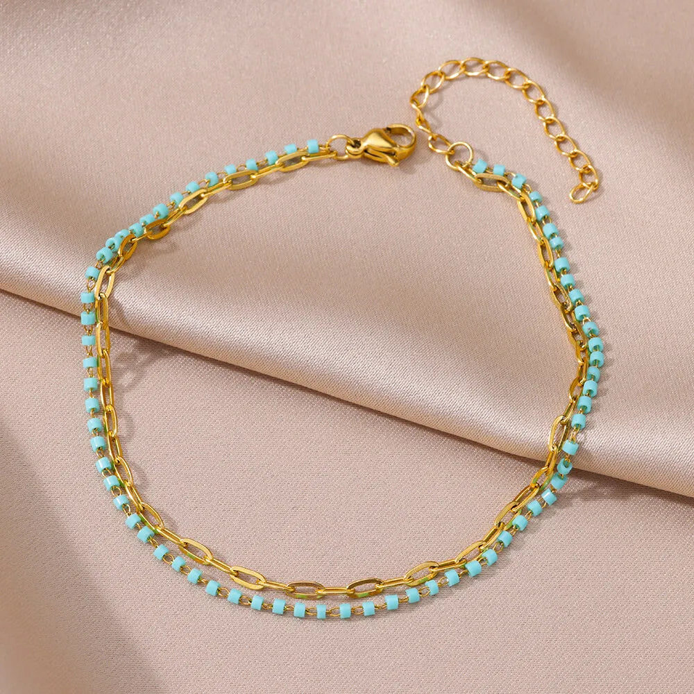 Chaîne de Cheville Dorée avec Croix et Pierres Zirconium